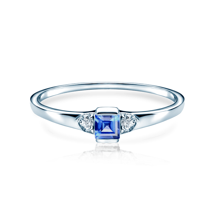 Three-Stone Engagement Ring: white gold, blue sapphire, diamonds