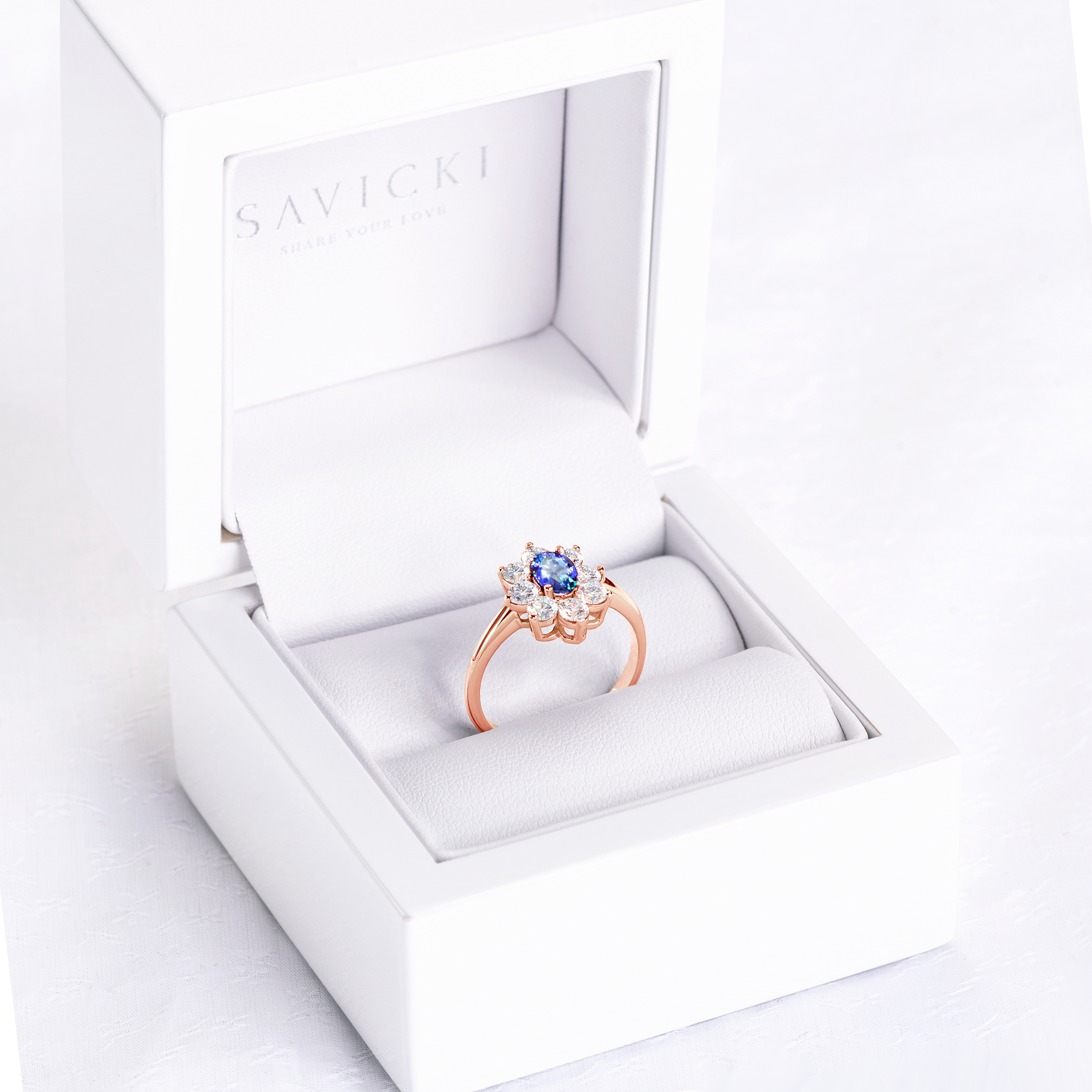 Pierścionek zaręczynowy SAVICKI: różowe złoto, tanzanit, białe szafiry